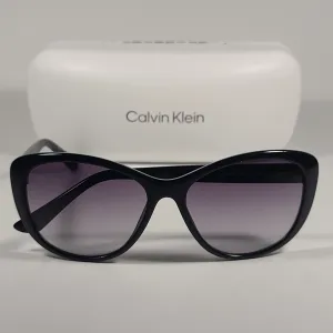 Calvin Klein Cat Eye Sunglasses CK19560S 001 Black Gloss Frame Gray Gradient Lens