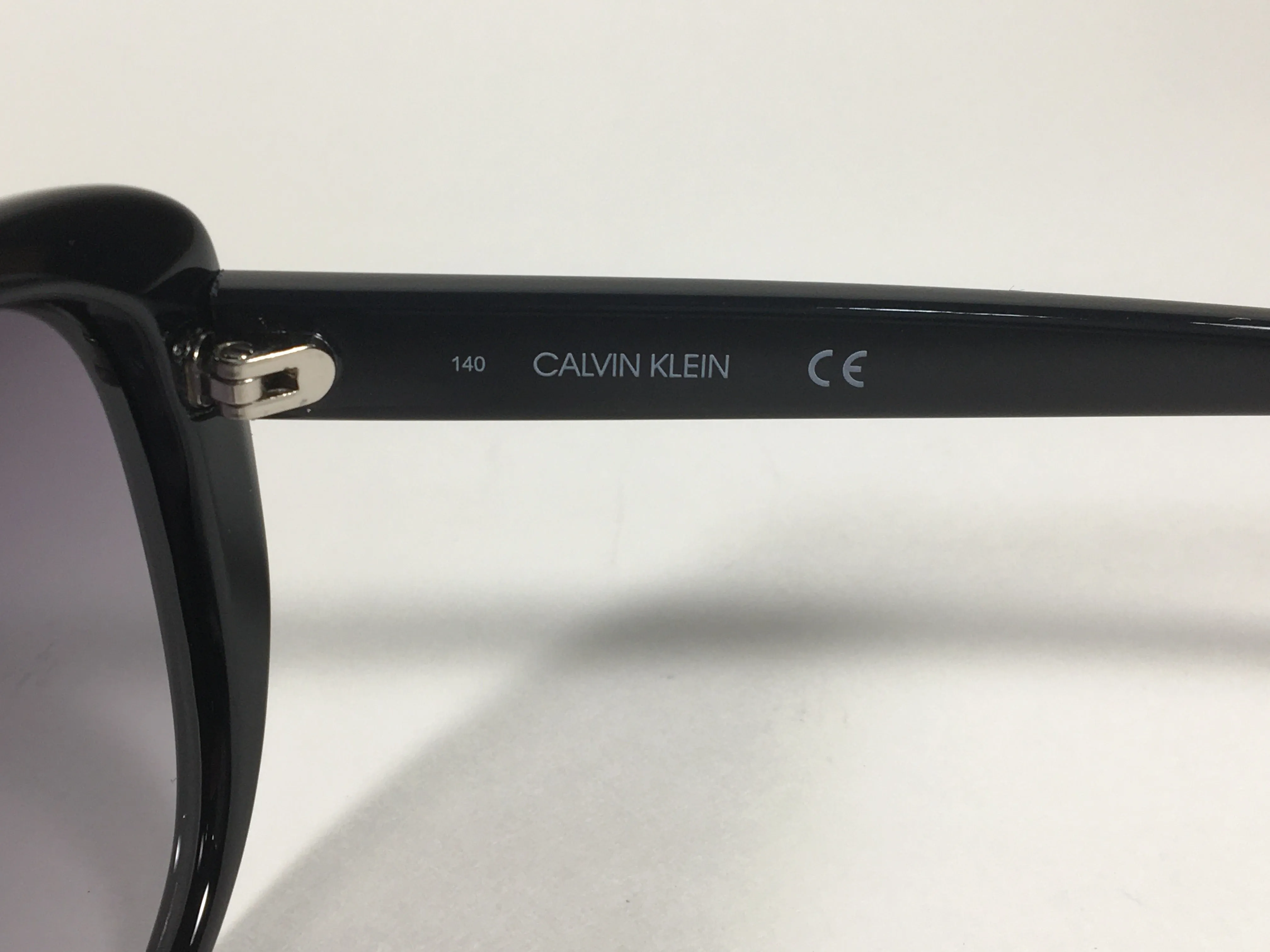 Calvin Klein Cat Eye Sunglasses CK19560S 001 Black Gloss Frame Gray Gradient Lens