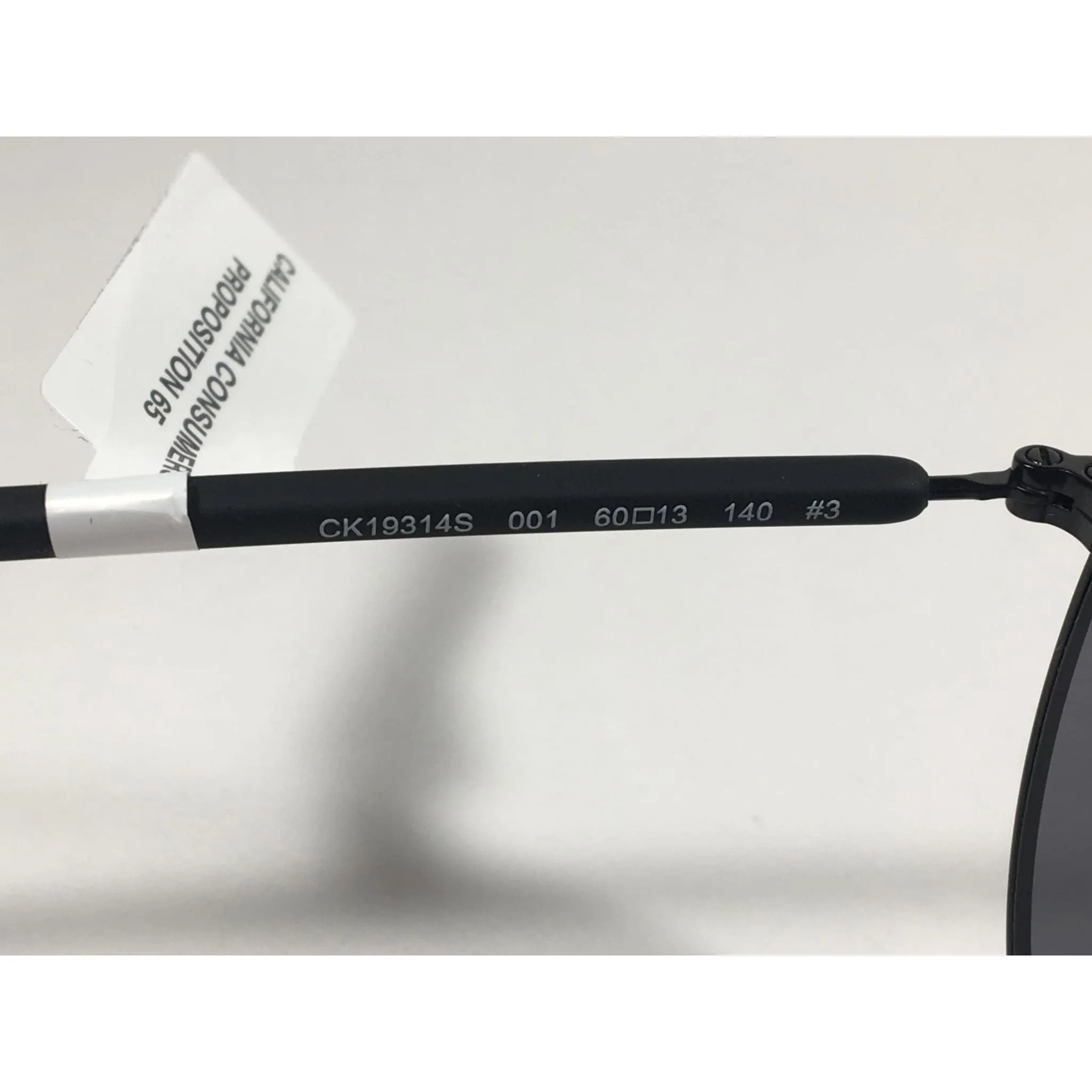 Calvin Klein CK19314S 001 Aviator Pilot Sunglasses Matte Black Metal and Plastic Frame Gray Lens