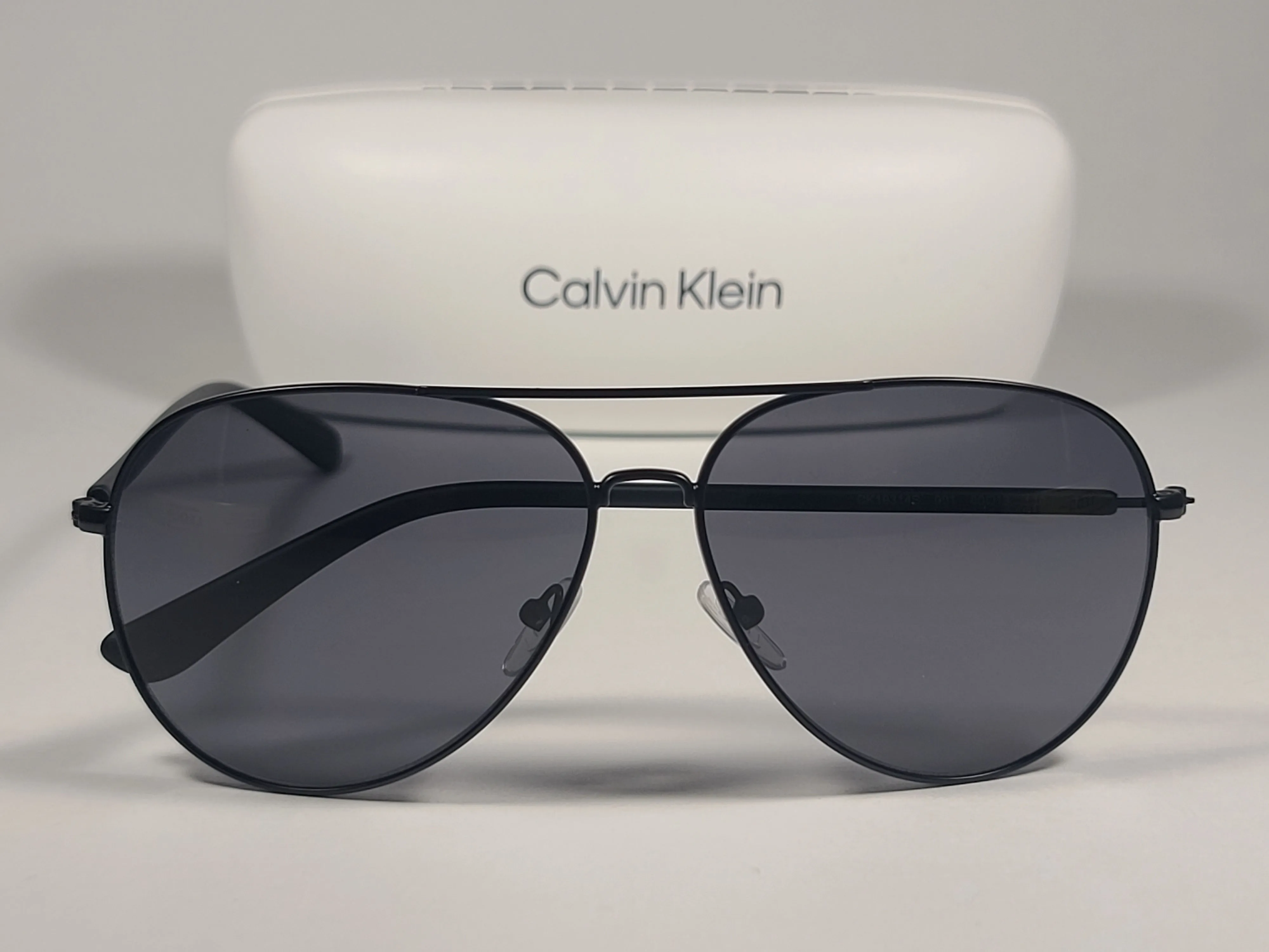 Calvin Klein CK19314S 001 Aviator Pilot Sunglasses Matte Black Metal and Plastic Frame Gray Lens